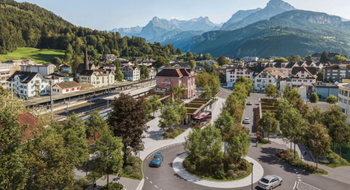 Eine Visualisierung der zukünftigen ÖV-Drehscheibe in der Gemeinde Ingenbohl mit einem grossen Bahnhof, eine einem neuen Kreisel und viel Grünflächen