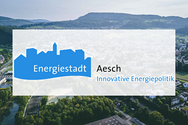Logo Energiestadt Aesch vor einem Luftbild