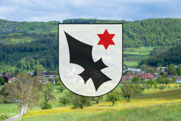 Aescher Wappen mit dem Dorf im Hintergrund