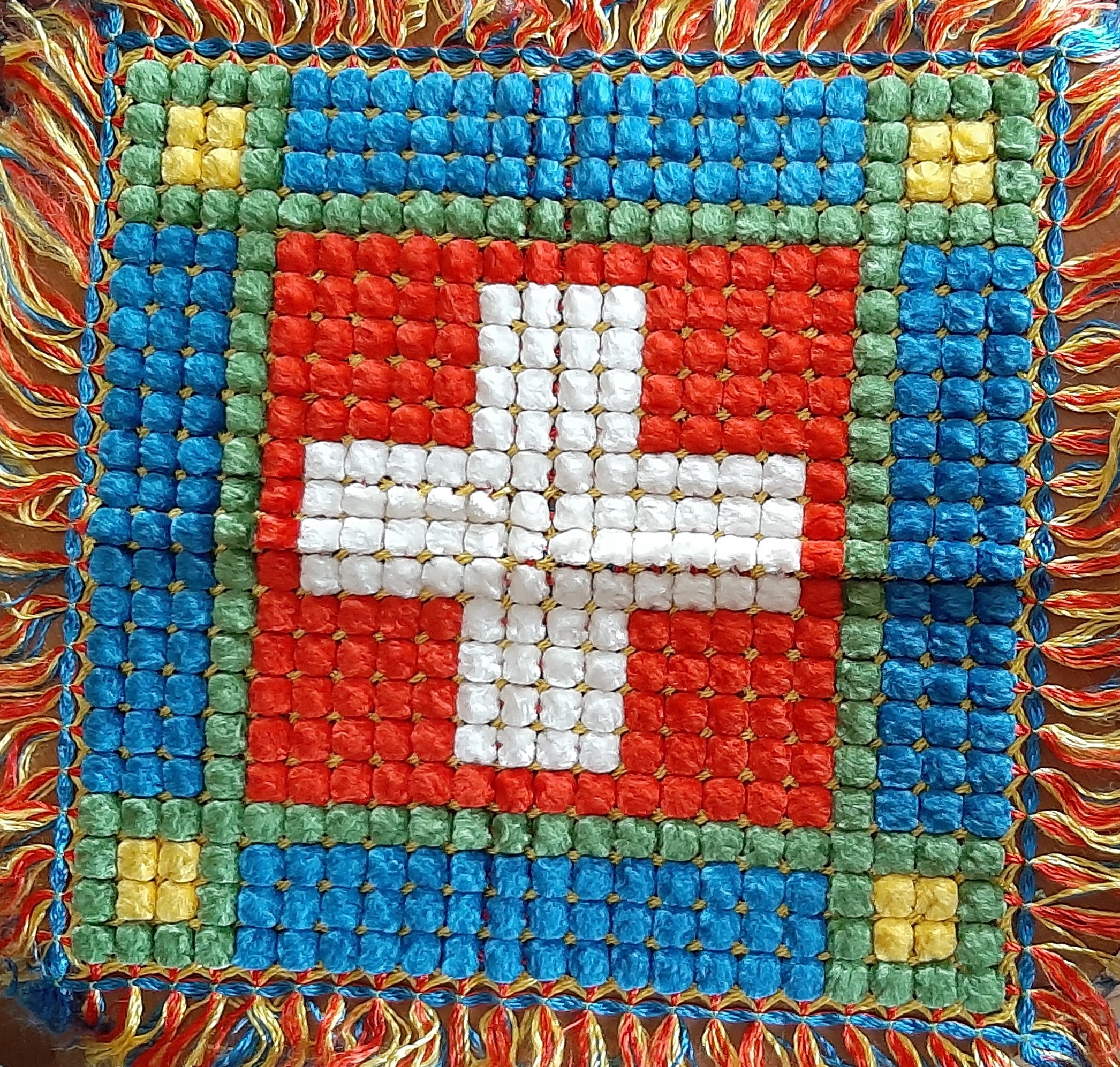 Eine Decke, die von einem polnischen Internierten geknüpft wurde. Geschenk an Mutter von Berta von Büren.