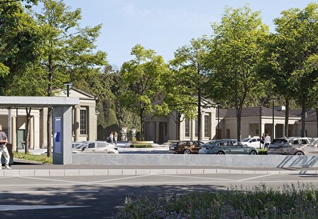 Moderne Bushaltestelle vor dem Friedhof mit Parkplatz und vielen Bäumen