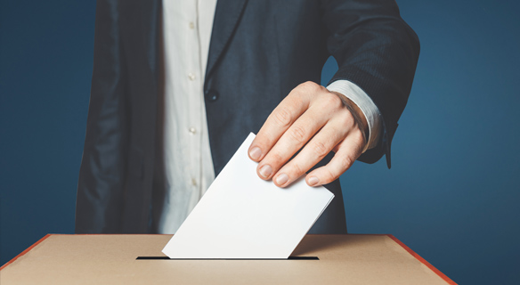 Photo d'un bulletin de vote et d'une urne de votation