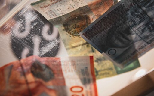 Banknoten und Logo Gemeinde Emmen