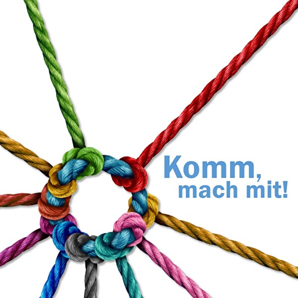 Bunte Schnüre verknüpfen sich und symbolisieren gemeinsames Wirken