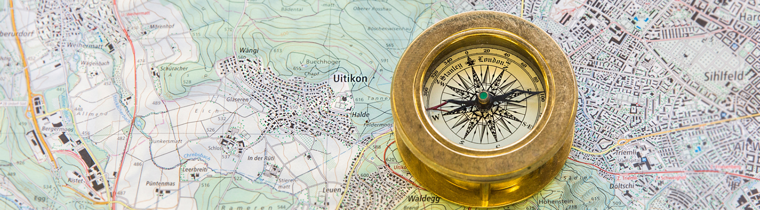 Karte mit dem Ort Uitikon, daneben liegt ein Kompass